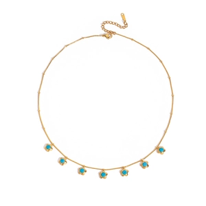 Collana in acciaio al titanio dorato con pendenti a fiore e pietre di turchese