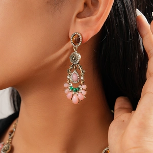 Detailed view of vintage bohemian earrings with colorful crystals on model