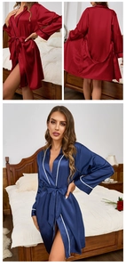 Detail of silk satin robes with contrast piping and tie waist in red and navy colors