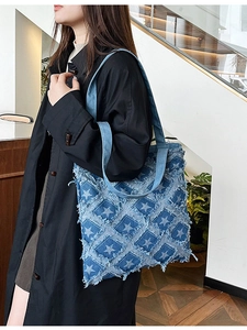 Blue denim checkerboard tote bag with star patches and fringe detail for women