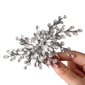 Elegant bridal hair comb with silver leaf design and sparkling crystals for wedding hairstyles