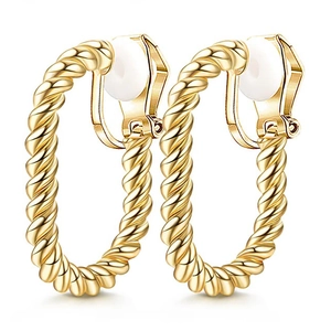 Detail of gold twisted clip-on earrings with white comfort pads on white background