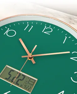 Detail view of the rose gold metal pointers and green dial with an integrated LCD display