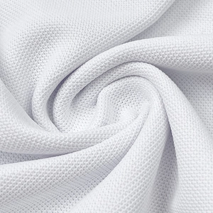 Close-up of white breathable piqué fabric texture for premium men's short sleeve polo shirt