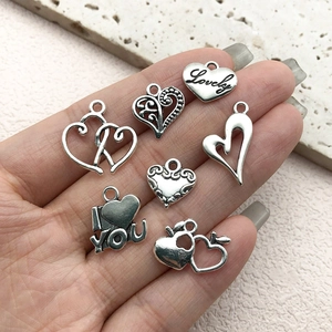Vintage alloy heart pendants with Love engraving and hollow design in antique silver finish