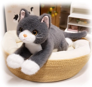 Detailed view of realistic gray and white plush cat resting in a woven pet basket
