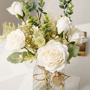 Artificial white rose bouquet in textured glass vase with wooden heart charm decoration