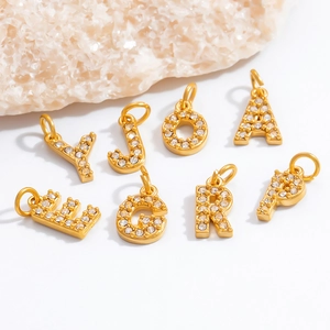 Golden 18K plated stainless steel initial pendants with sparkling zircon crystal inlays