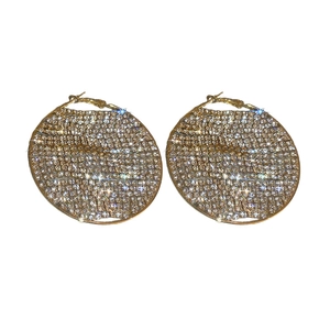 Exaggerated geometric circle earrings with full zircon inlay on a white background