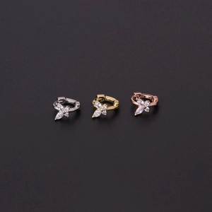 Detailed view of trio butterfly ear cuffs in silver, gold, and rose gold with zircon stones