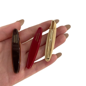 Lot de 3 barrettes géométriques en acétate coloris ambre, rouge et beige crème