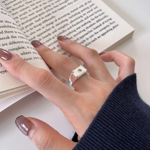 Irregular texture S925 sterling silver ring with rectangular yellow gemstone on a model