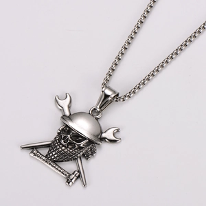 Detailed macro of pirate skull pendant with boiler makers text and wrench cross