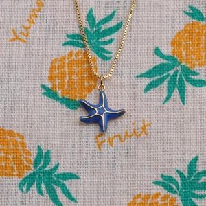 Golden box chain necklace with blue enamel starfish pendant in summer ocean style