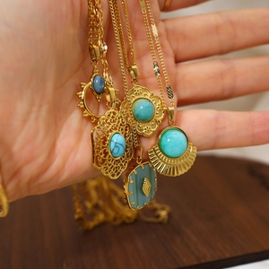 Vintage gold hollowed-out pendant necklaces with blue natural stone for women