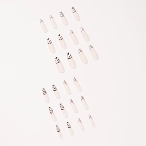Long ballet press-on nails in nude pink with black geometric leopard stripe patterns