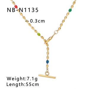 Detail of colorful resin beads and gold OT toggle clasp on a French vintage necklace
