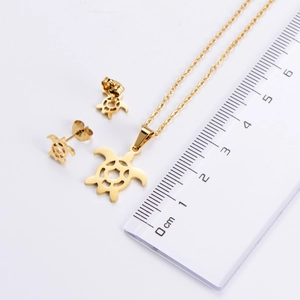 Detail view of hollow turtle pendant jewelry set with a scale ruler for size measurement