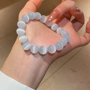 Detailed close-up of grey cat eye stone beaded bracelet showing unique light reflection