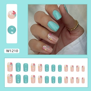 Short square press-on nails with mint green finish and delicate floral pattern