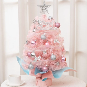 Close-up of pink 55cm mini Christmas tree with silver baubles and Merry Christmas sign