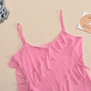 Detailed view of pink ruffled layered fabric with thin adjustable straps on top