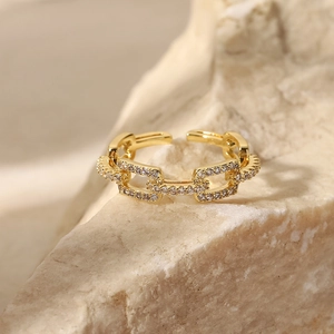 Macro view of 18K gold plated chain link ring with micro-paved sparkling cubic zirconia