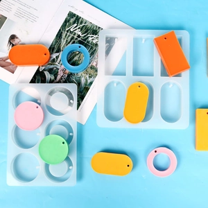 Macro detail of multi-shape silicone soap molds with colorful resin geometric samples