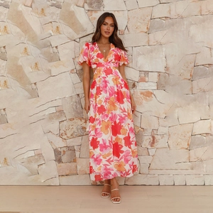 Close-up of floral backless maxi dress with side cut-outs and V-neckline detail