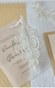 Detail of white glitter hollow ornament with intricate scroll patterns for Christmas tree