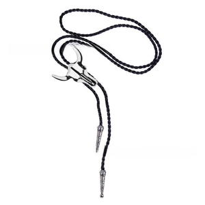 Detail of silver bull skull pendant on black braided leather western bolo tie necklace