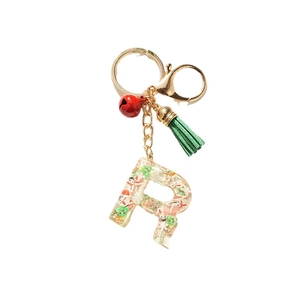 Christmas letter R resin keychain with snowman, tree, bell and green tassel details