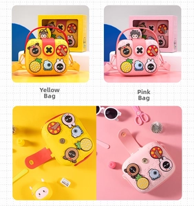 Close-up of yellow and pink cartoon silicone crossbody bags with 3D patterns and snap closure