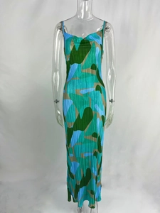 Close-up of pleated camo print fabric on a slim-fit cami maxi dress with V-neck detail