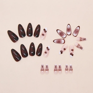 Detail of coffee bean 3D nail art and French ombre gradient on brown almond press-on nails