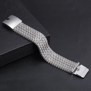 Detailed macro view of heavy-duty silver mesh woven bracelet with wide metal buckle