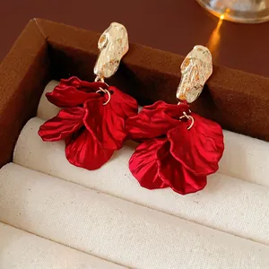 Retro red petal tassel earrings with textured gold metal accents for a luxury style