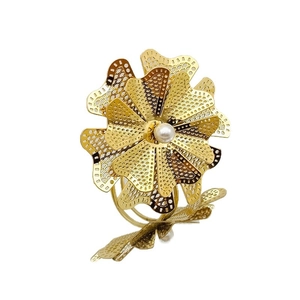Elegant gold flower napkin ring with hollow mesh petals and a central faux pearl accent