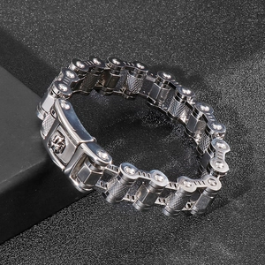 Industrial punk skull bike chain bracelet in polished steel, 45-degree angle view