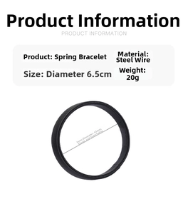 Detail of black steel spring bracelet with 65mm inner diameter and elastic texture
