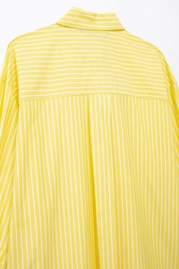 Detailed back view of yellow and white striped shirt showing collar and yoke seam