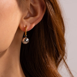 Two-tone stainless steel hoop earrings with gold circle and silver ball pendant for women