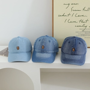 Set of three denim baseball caps for kids with cute bear embroidery in shades of blue
