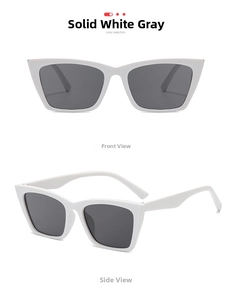 Front and side view of white cat-eye sunglasses with dark grey lenses in a macro shot