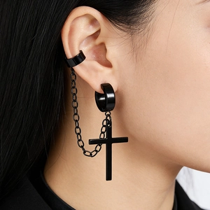 Detail of punk matte black chain earring with ear cuff and cross pendant on ear