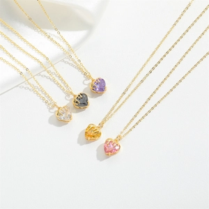 French vintage heart zircon pendant necklaces in multiple colors on white silk background