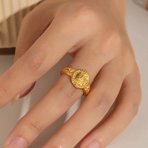18k gold-plated stainless steel ring with geometric clock pattern on female model