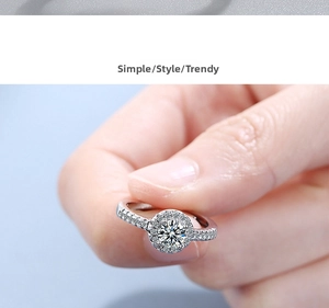 Macro shot of a classic halo engagement ring with round cut center stone and pavé band