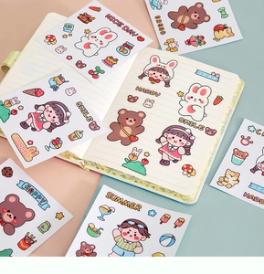 Detail of cute cartoon animal stickers for water bottles on a pink and green notebook