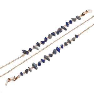 Handmade gold eyewear chain featuring natural lapis lazuli stones and anti-slip silicone loops